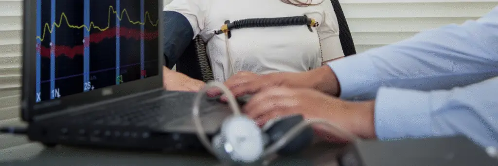 A professional polygraph examiner, accredited by the American Polygraph Association, administers a confidential lie detector test in a modern Chico office. The examiner uses advanced computerized equipment to ensure accurate and discreet results for clients seeking clarity in personal or legal matters